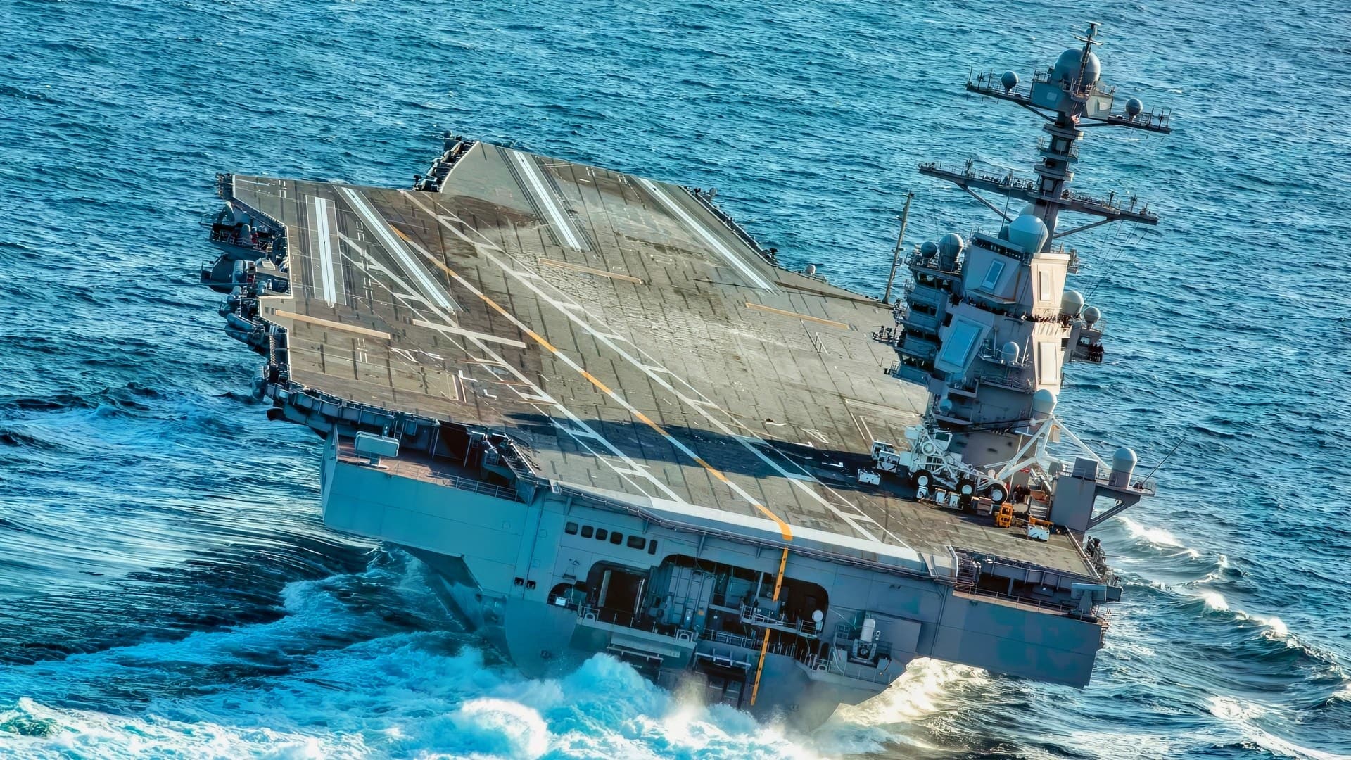 USS Gerald R. Ford (CVN 78) conducts high-speed turns in the Atlantic Ocean. Ford is at sea conducting sea trials following the in port portion of its 15 month post-shakedown availability. (U.S. Navy photo by Mass Communication Specialist 3rd Class Connor Loessin)