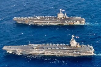 The US Navy Planned to Deliver the Aircraft Carrier USS John F. Kennedy in July 2025. She Is Now Due in March 2027. The 20-Month Slip Came Down to Arresting Gear Certification and the Weapons Elevators — the Same 2 Systems That Held Up USS Gerald R. Ford.